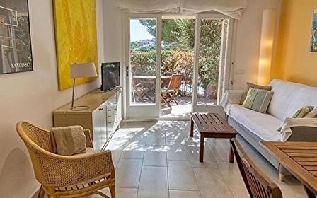 Central and with a large terrace, Tamariu